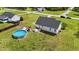 Spacious backyard featuring a refreshing above-ground pool with deck, ideal for summer fun at 82 Sommerset Dr, Clayton, NC 27520
