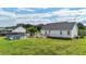 Expansive backyard with an above-ground pool and wooden deck, perfect for outdoor entertaining and relaxation at 82 Sommerset Dr, Clayton, NC 27520