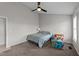 Bedroom displaying a twin bed, toy box, ceiling fan, and neutral-colored walls at 82 Sommerset Dr, Clayton, NC 27520