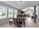 Open dining area with a view into the living room and three large windows providing natural light at 82 Sommerset Dr, Clayton, NC 27520
