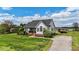 Beautiful home featuring a well-maintained lawn, convenient driveway, and inviting outdoor deck at 82 Sommerset Dr, Clayton, NC 27520