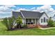 Charming single-story home featuring a welcoming front porch and a well-manicured lawn at 82 Sommerset Dr, Clayton, NC 27520
