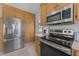 Kitchen featuring wood cabinets and stainless steel appliances, a great design at 82 Sommerset Dr, Clayton, NC 27520