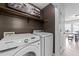 Convenient laundry room featuring updated machines and extra storage at 82 Sommerset Dr, Clayton, NC 27520