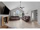 Spacious living room with vaulted ceilings, a fireplace, and neutral-toned walls and floors at 82 Sommerset Dr, Clayton, NC 27520