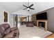 Open-concept living area seamlessly connects to the kitchen, featuring modern flooring and cozy furnishings at 82 Sommerset Dr, Clayton, NC 27520