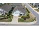 Aerial view of a charming home with well-maintained landscaping and a paved driveway at 85 Bramble Ln, Clayton, NC 27527