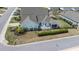 Aerial view of a beautiful home showcasing a patio, manicured lawn, and lush landscaping at 85 Bramble Ln, Clayton, NC 27527