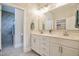 Bright bathroom featuring double vanity with ample storage and well-lit mirror for comfortable routines at 85 Bramble Ln, Clayton, NC 27527