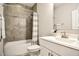 Bathroom with shower and tub combination, white vanity and gray walls at 85 Bramble Ln, Clayton, NC 27527