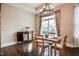 Formal dining room with chandelier, hardwood floors, and large window at 85 Bramble Ln, Clayton, NC 27527