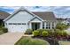 Charming single-story home with a well-manicured lawn and a two-car garage at 85 Bramble Ln, Clayton, NC 27527