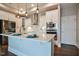 Island kitchen featuring stainless appliances, pendant lighting, and a pantry at 85 Bramble Ln, Clayton, NC 27527