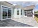 Outdoor patio with a beautiful stamped concrete design, complemented by a screened-in porch and sliding glass door at 85 Bramble Ln, Clayton, NC 27527