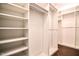 Spacious walk-in closet with ample shelving and hanging space for organized storage at 85 Bramble Ln, Clayton, NC 27527