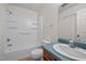 Clean bathroom includes a tub shower, toilet, and sink vanity at 922 Royal Oaks Dr, Durham, NC 27712