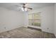 A simple carpeted bedroom with a ceiling fan and one window at 922 Royal Oaks Dr, Durham, NC 27712