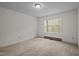 Neutral bedroom with carpet and a window with blinds at 922 Royal Oaks Dr, Durham, NC 27712