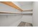 Walk-in closet with carpet and multiple shelves and hanging rods at 922 Royal Oaks Dr, Durham, NC 27712