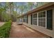 Exterior of this lovely beige home, features large windows and a brick patio at 922 Royal Oaks Dr, Durham, NC 27712