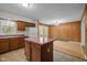 Retro kitchen features wood cabinets, island and a sunlit breakfast nook with access to the deck at 922 Royal Oaks Dr, Durham, NC 27712
