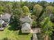 An aerial view of the property, showcasing the house, garage, shed, basketball court, and backyard at 104 Glenview Pl, Chapel Hill, NC 27514