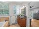 Bright bathroom featuring vanity with a black countertop at 104 Glenview Pl, Chapel Hill, NC 27514