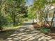 Long driveway leading to a property, shaded by trees, creating a private and scenic entrance at 104 Glenview Pl, Chapel Hill, NC 27514