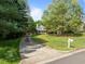 View of the exterior of a home including a driveway, yard, and a partial view of the facade at 104 Glenview Pl, Chapel Hill, NC 27514