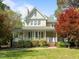 Charming two-story home with a welcoming front porch and well-manicured landscaping at 104 Glenview Pl, Chapel Hill, NC 27514
