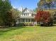 Charming two-story home with a welcoming front porch and well-manicured landscaping at 104 Glenview Pl, Chapel Hill, NC 27514