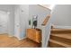 Inviting foyer featuring hardwood floors, a stylish console table, and a staircase at 104 Glenview Pl, Chapel Hill, NC 27514