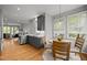 Kitchen featuring modern stainless steel appliances open to an eat-in kitchen with seating for four at 104 Glenview Pl, Chapel Hill, NC 27514