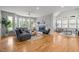 Spacious living room boasts a cozy fireplace, hardwood floors, and plenty of natural light at 104 Glenview Pl, Chapel Hill, NC 27514