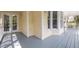 View of the porch with painted floorboards on an exterior wall and a door with glass windows at 104 Glenview Pl, Chapel Hill, NC 27514