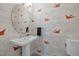 Charming powder room featuring unique wallpaper and a pedestal sink at 104 Glenview Pl, Chapel Hill, NC 27514