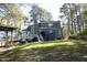 Home's exterior with a deck and a backyard featuring a play area at 105 Guldahl Ct, Morrisville, NC 27560