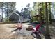 Private backyard with a fire pit and Adirondack chairs, perfect for outdoor entertaining at 105 Guldahl Ct, Morrisville, NC 27560