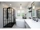Bright bathroom featuring a sleek, modern design with a freestanding tub and a separate glass-enclosed shower at 105 Guldahl Ct, Morrisville, NC 27560