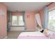 Bright room features a window seat, light pink walls, and playful decor at 105 Guldahl Ct, Morrisville, NC 27560