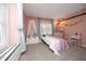 Charming bedroom with a pink wall, canopy bed, and playful decor at 105 Guldahl Ct, Morrisville, NC 27560