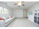Versatile bonus room featuring a plush couch, ample storage, and a spacious layout at 105 Guldahl Ct, Morrisville, NC 27560