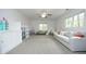 Versatile bonus room featuring a plush couch, ample storage, and a spacious layout at 105 Guldahl Ct, Morrisville, NC 27560