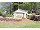 Welcome to Preston, sign with colorful flowers and lush landscaping at entrance of neighborhood in Morrisville at 105 Guldahl Ct, Morrisville, NC 27560