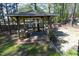 Relaxing gazebo furnished with a cushioned bench in a private backyard at 105 Guldahl Ct, Morrisville, NC 27560