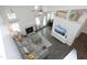 Aerial view of the open-concept living room with modern decor and a cozy fireplace feature at 105 Guldahl Ct, Morrisville, NC 27560