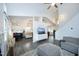 Open-concept living area with high ceilings, a modern TV console, and a glimpse into the kitchen and dining areas at 105 Guldahl Ct, Morrisville, NC 27560