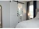 View from the main bedroom with a sliding barn door that leads into the en suite bathroom at 105 Guldahl Ct, Morrisville, NC 27560
