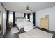 Spacious main bedroom with a ceiling fan, plush carpet, and large windows providing ample natural light at 105 Guldahl Ct, Morrisville, NC 27560