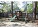 Backyard featuring a wooden playground set with a slide and swings at 105 Guldahl Ct, Morrisville, NC 27560